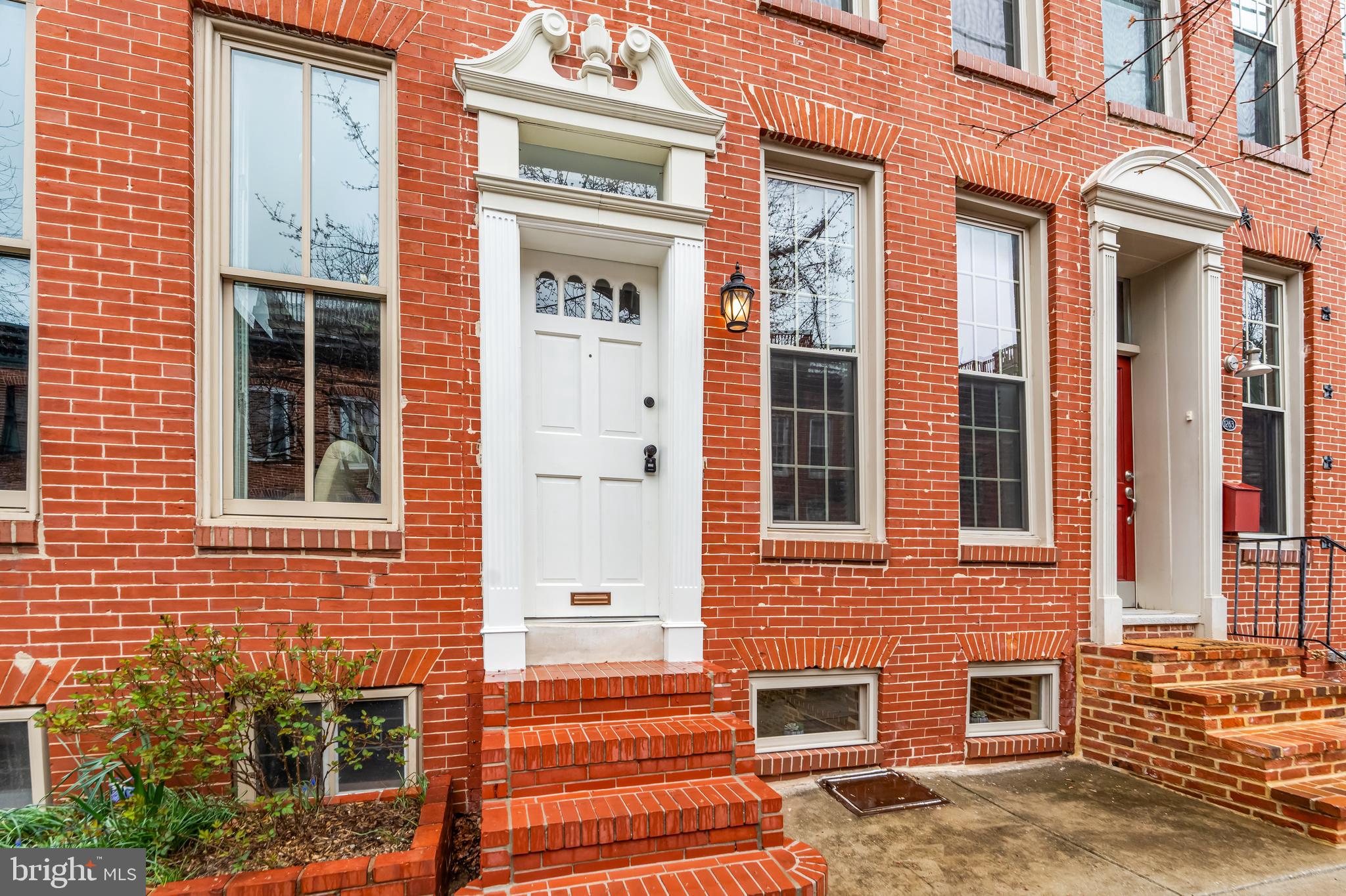 1261 Riverside Avenue Baltimore, MD 21230 - Photo 2 of 60 a front view of a multi story residential apartment building
