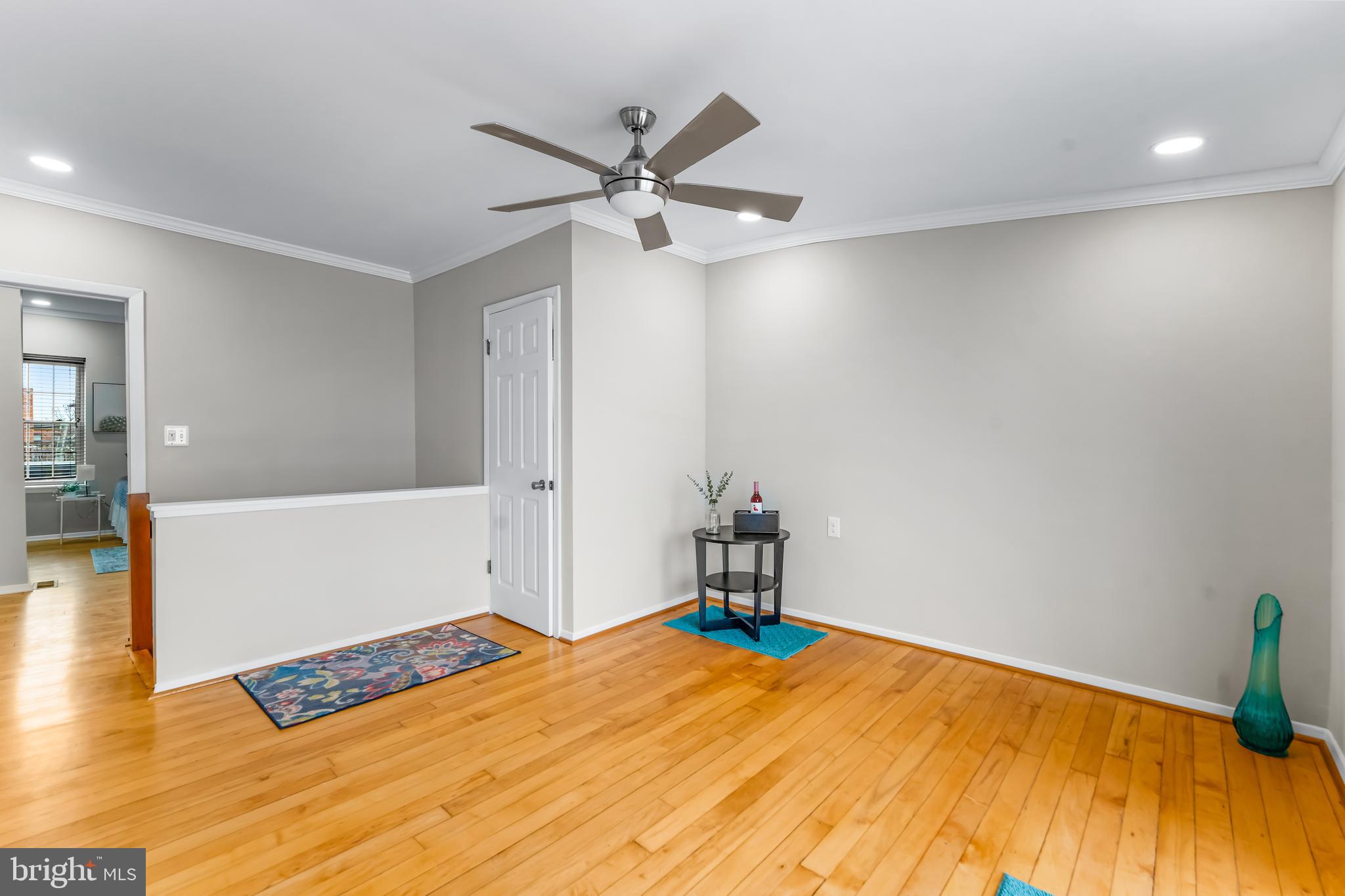 1261 Riverside Avenue Baltimore, MD 21230 - Photo 26 of 60 a bedroom with a bed and a ceiling fan
