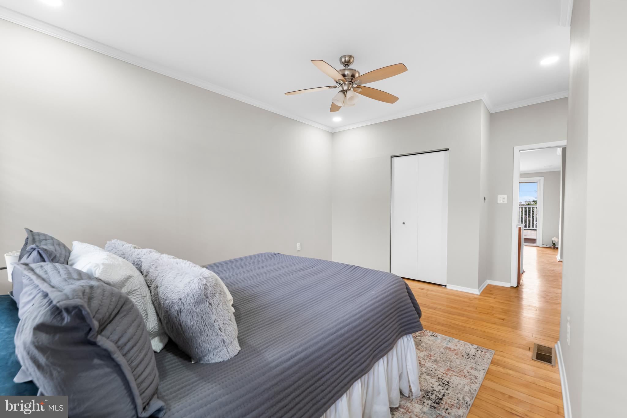 1261 Riverside Avenue Baltimore, MD 21230 - Photo 32 of 60 a bedroom with a bed and a chandelier