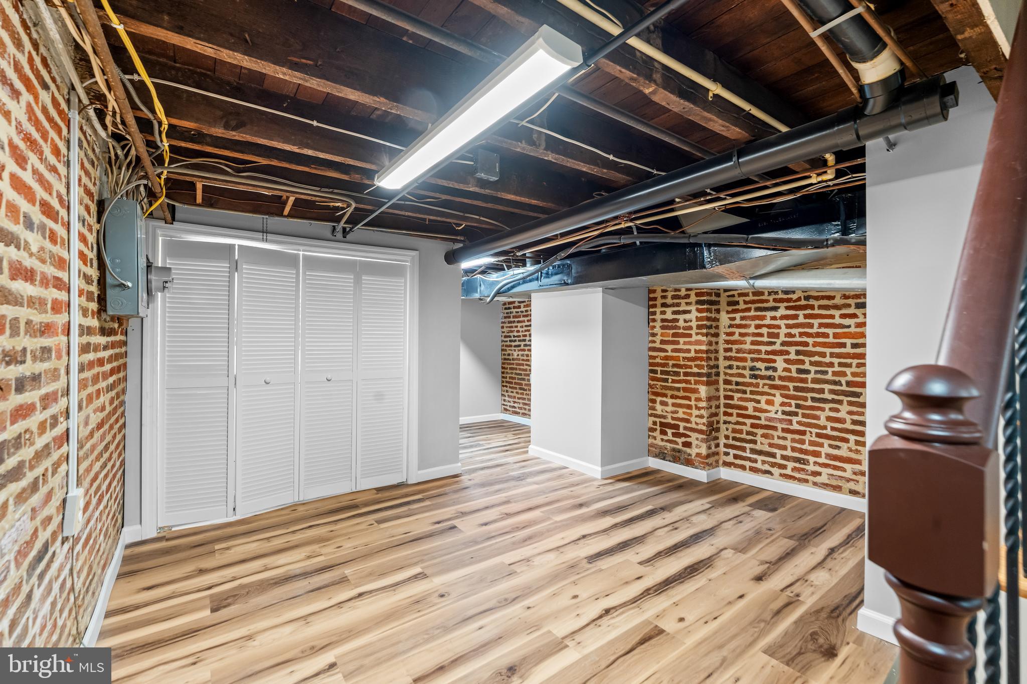 1261 Riverside Avenue Baltimore, MD 21230 - Photo 36 of 60 a view of an empty room with wooden floor