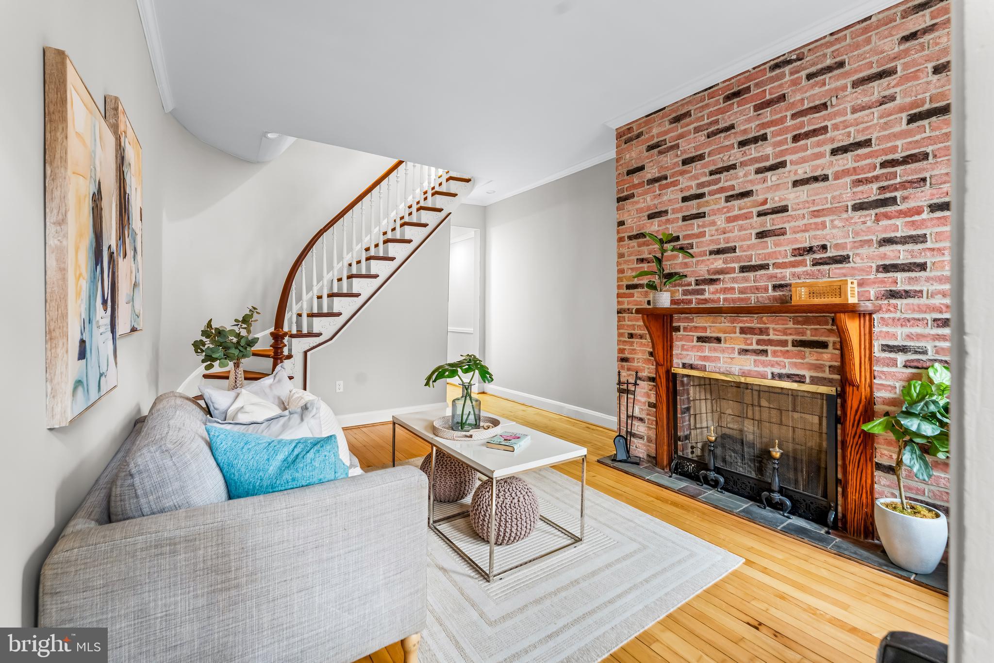 1261 Riverside Avenue Baltimore, MD 21230 - Photo 8 of 60 a living room with furniture and a fireplace