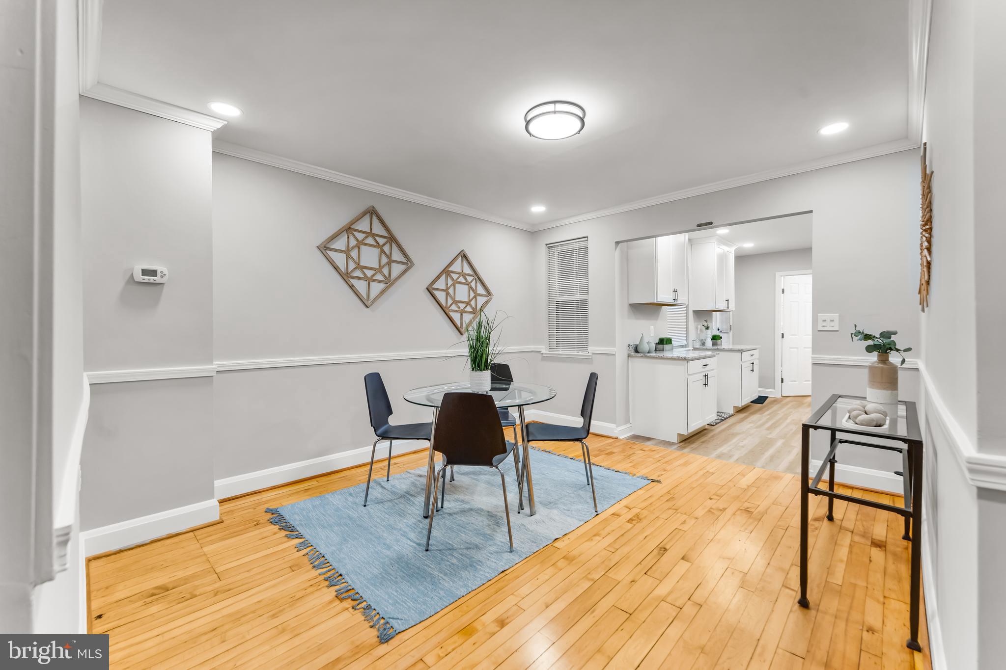 1261 Riverside Avenue Baltimore, MD 21230 - Photo 9 of 60 a view of a kitchen with dining table and chairs