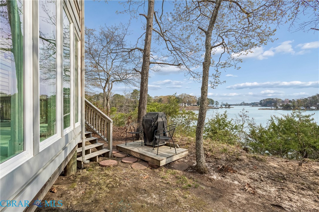 172 Sturgeon Creek Road Deltaville, VA 23043 - Photo 17 of 50 View of yard featuring a deck with water view