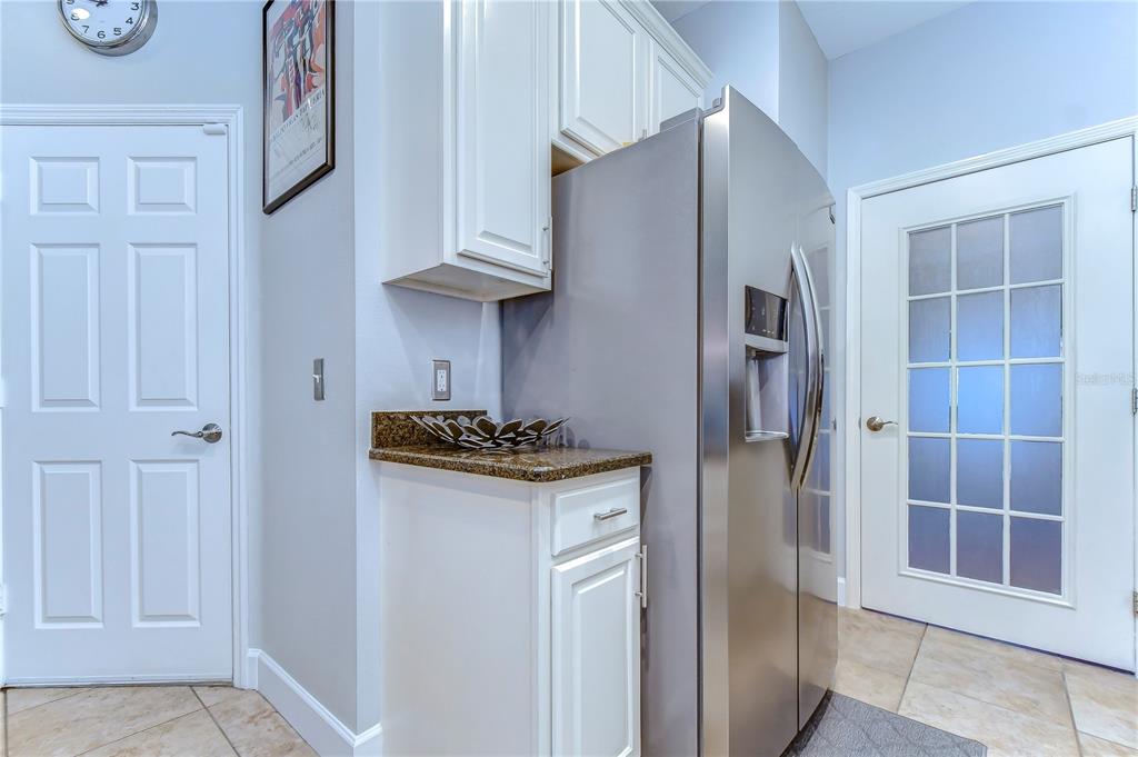 8507 Sandpiper Ridge Avenue Tampa, FL 33647 - Photo 15 of 48 a kitchen with stainless steel appliances granite countertop a refrigerator and a sink