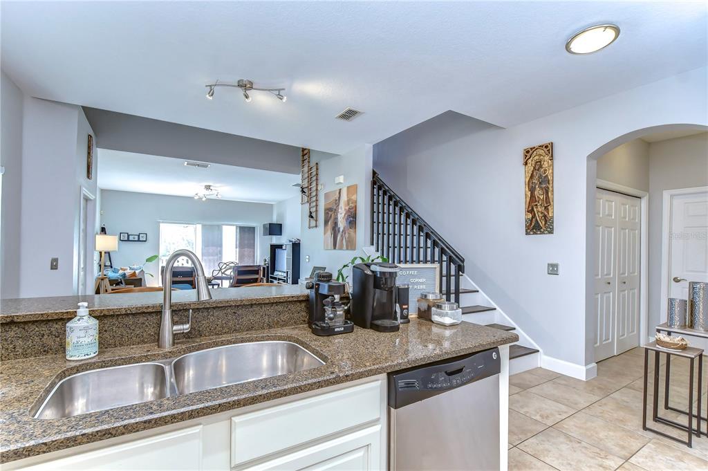 8507 Sandpiper Ridge Avenue Tampa, FL 33647 - Photo 16 of 48 a kitchen with sink and refrigerator