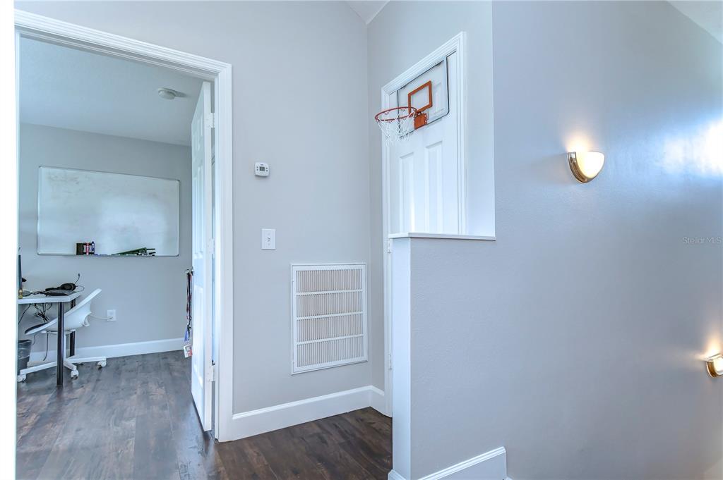 8507 Sandpiper Ridge Avenue Tampa, FL 33647 - Photo 21 of 48 a view of hallway with wooden floor