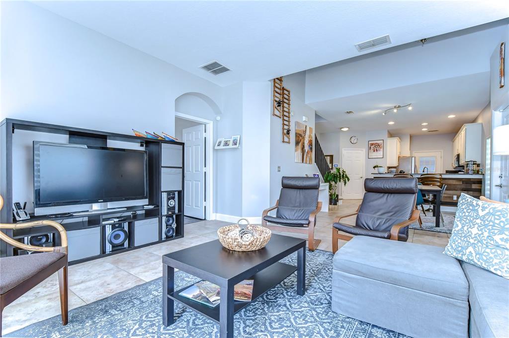 8507 Sandpiper Ridge Avenue Tampa, FL 33647 - Photo 31 of 48 a living room with furniture and a flat screen tv