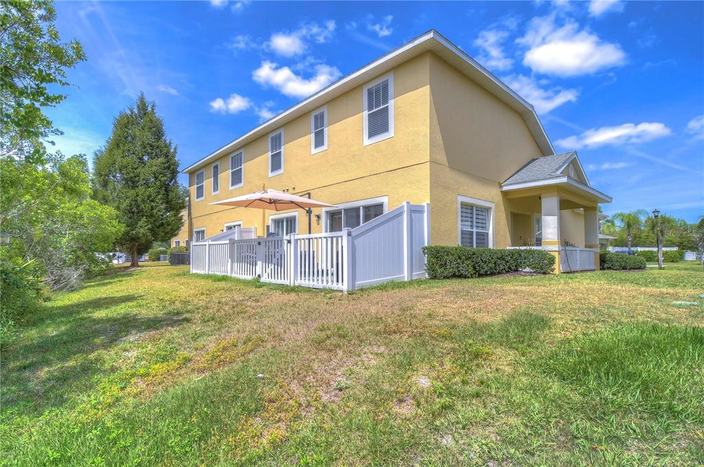 8507 Sandpiper Ridge Avenue Tampa, FL 33647 - Photo 39 of 48 a view of a house with a yard