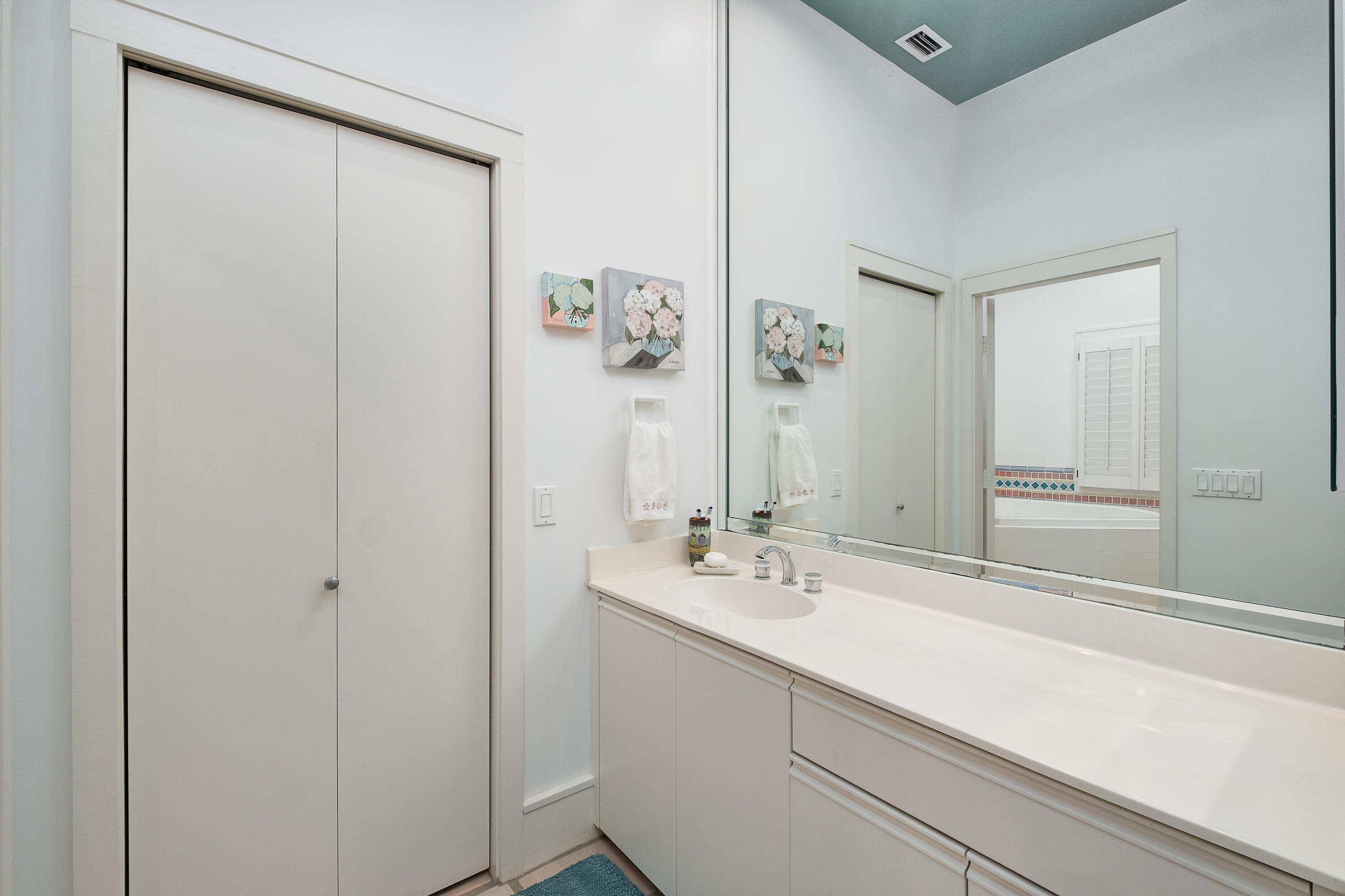 800 Blue Mountain Road Santa Rosa Beach, FL 32459 - Photo 25 of 71 a bathroom with a sink and a mirror