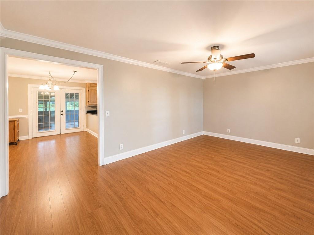 212 Craigtown Road Northeast Calhoun, GA 30701 - Photo 3 of 21 wooden floor in an empty room with a window
