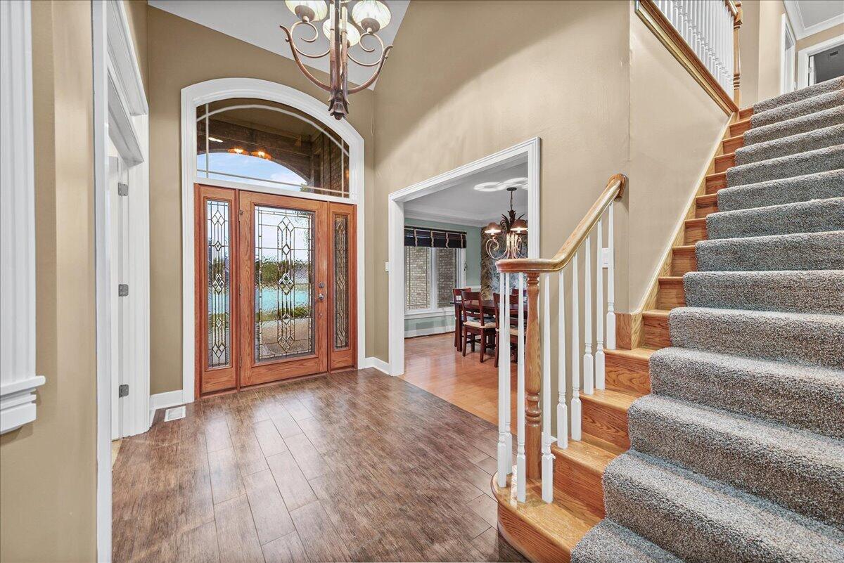 8751 Bridgewater Court Crown Point, IN 46307 - Photo 21 of 49 a view of entryway and hall with wooden floor