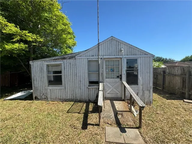 a house view with a backyard space