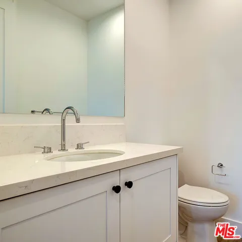 an empty room with wooden floor and a window