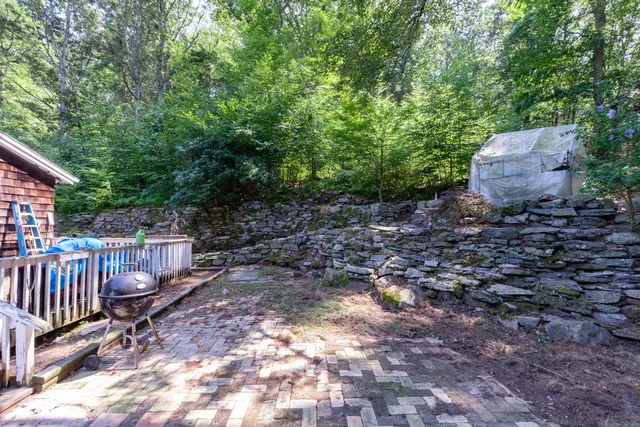 a backyard of a house with lots of green space