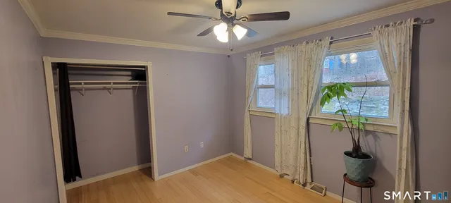 a hallway with sliding door and natural light