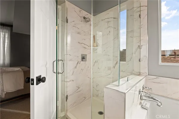 a bathroom with a sink and shower
