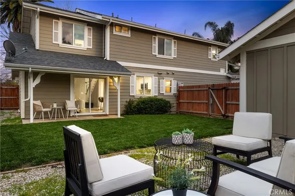 a view of a yard with furniture and a yard