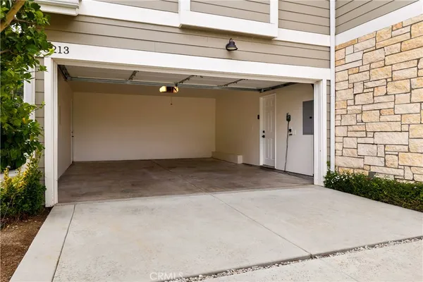 a view of backyard with a garage