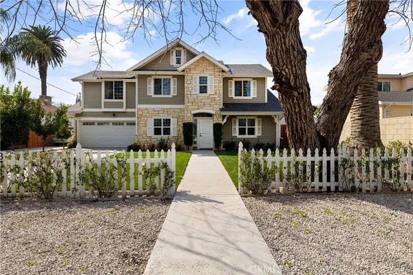 front view of a house with a garden