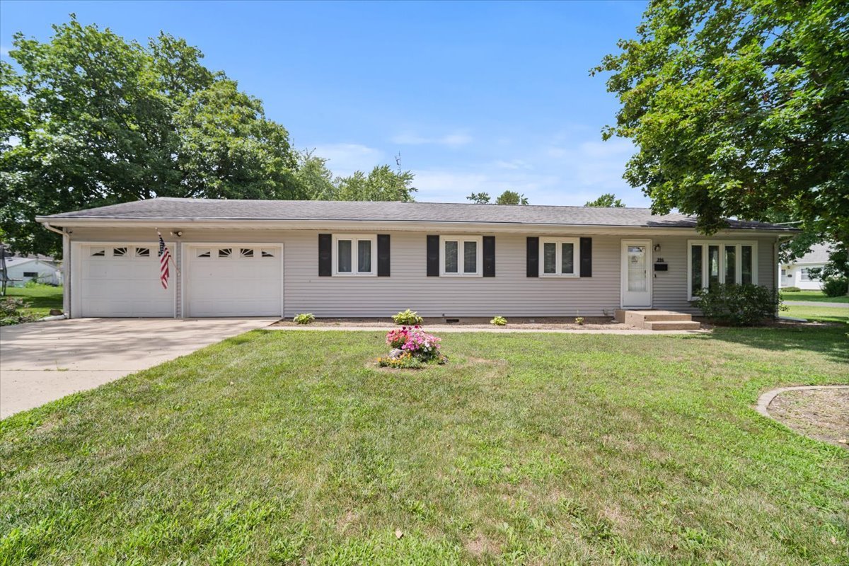 a backyard of a house with yard and outdoor seating