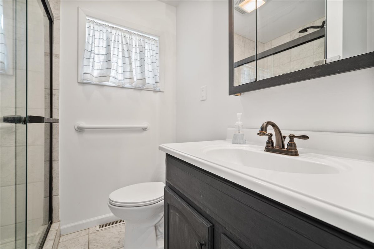 396 North Sherman Street El Paso, IL 61738 - Photo 20 of 29 a bathroom with a sink a toilet and vanity