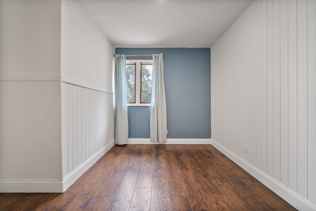396 North Sherman Street El Paso, IL 61738 - Photo 21 of 29 wooden floor in an empty room with a window
