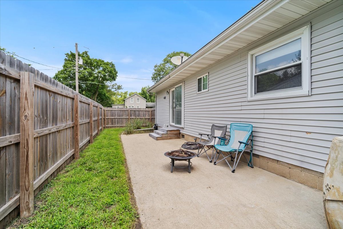 396 North Sherman Street El Paso, IL 61738 - Photo 23 of 29 a view of a backyard with table and chairs with wooden fence