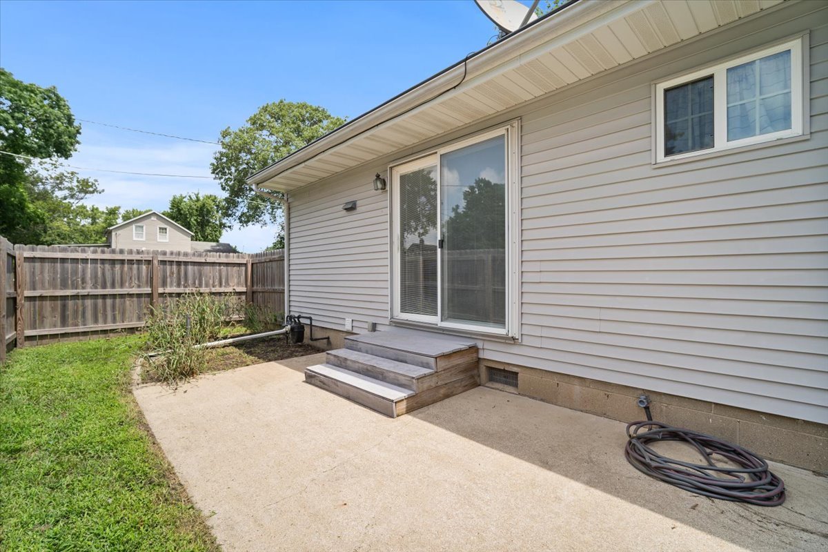 396 North Sherman Street El Paso, IL 61738 - Photo 24 of 29 a view of backyard with a chair and potted plants