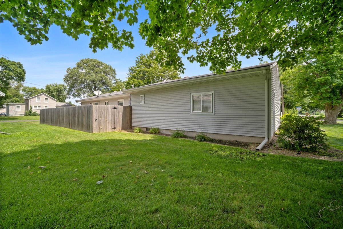 396 North Sherman Street El Paso, IL 61738 - Photo 25 of 29 a backyard of a house with plants and large tree
