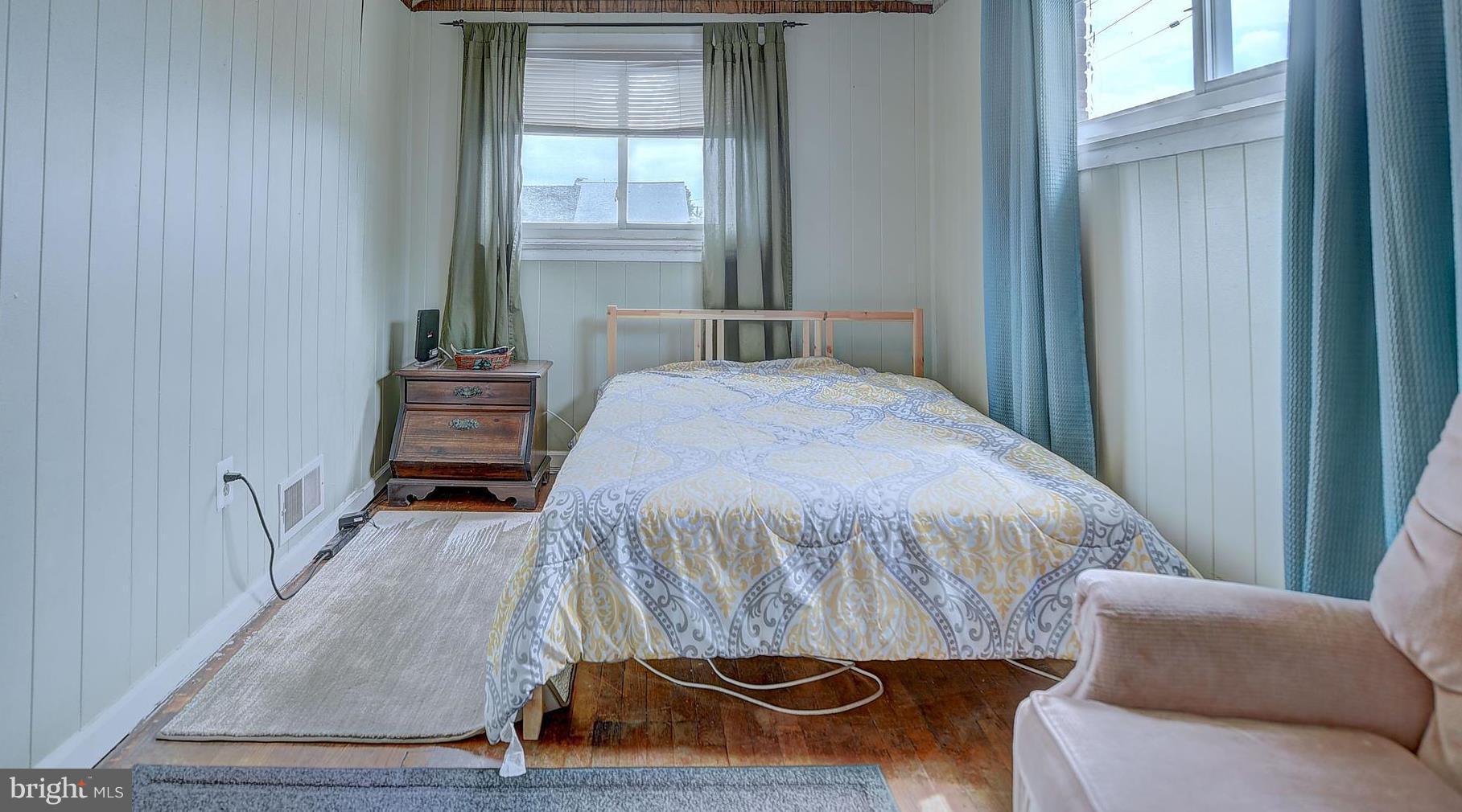 1944 Jasmine Road Baltimore, MD 21222 - Photo 14 of 25 a bedroom with a bed and a window