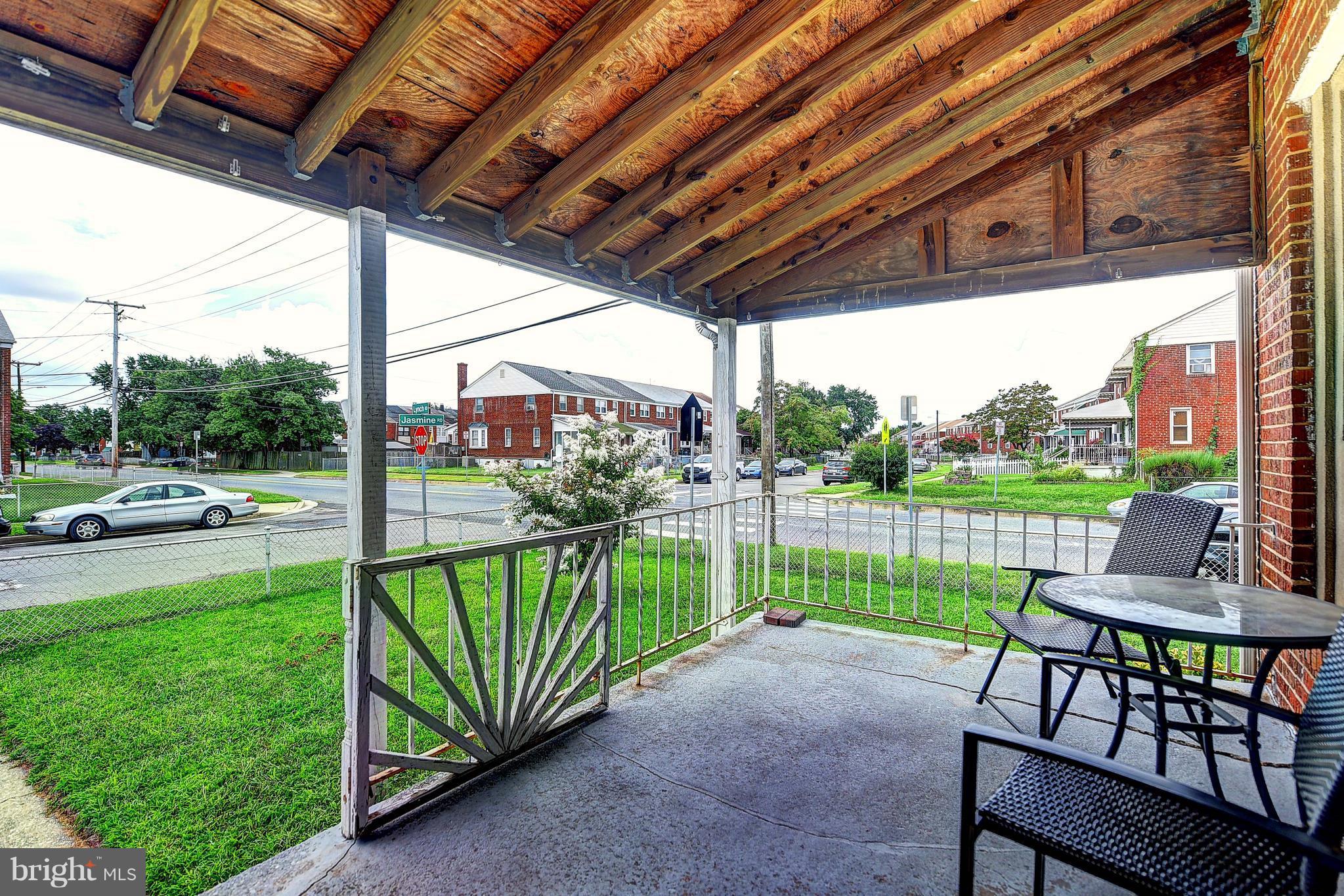 1944 Jasmine Road Baltimore, MD 21222 - Photo 22 of 25 a view of a porch with furniture and a yard