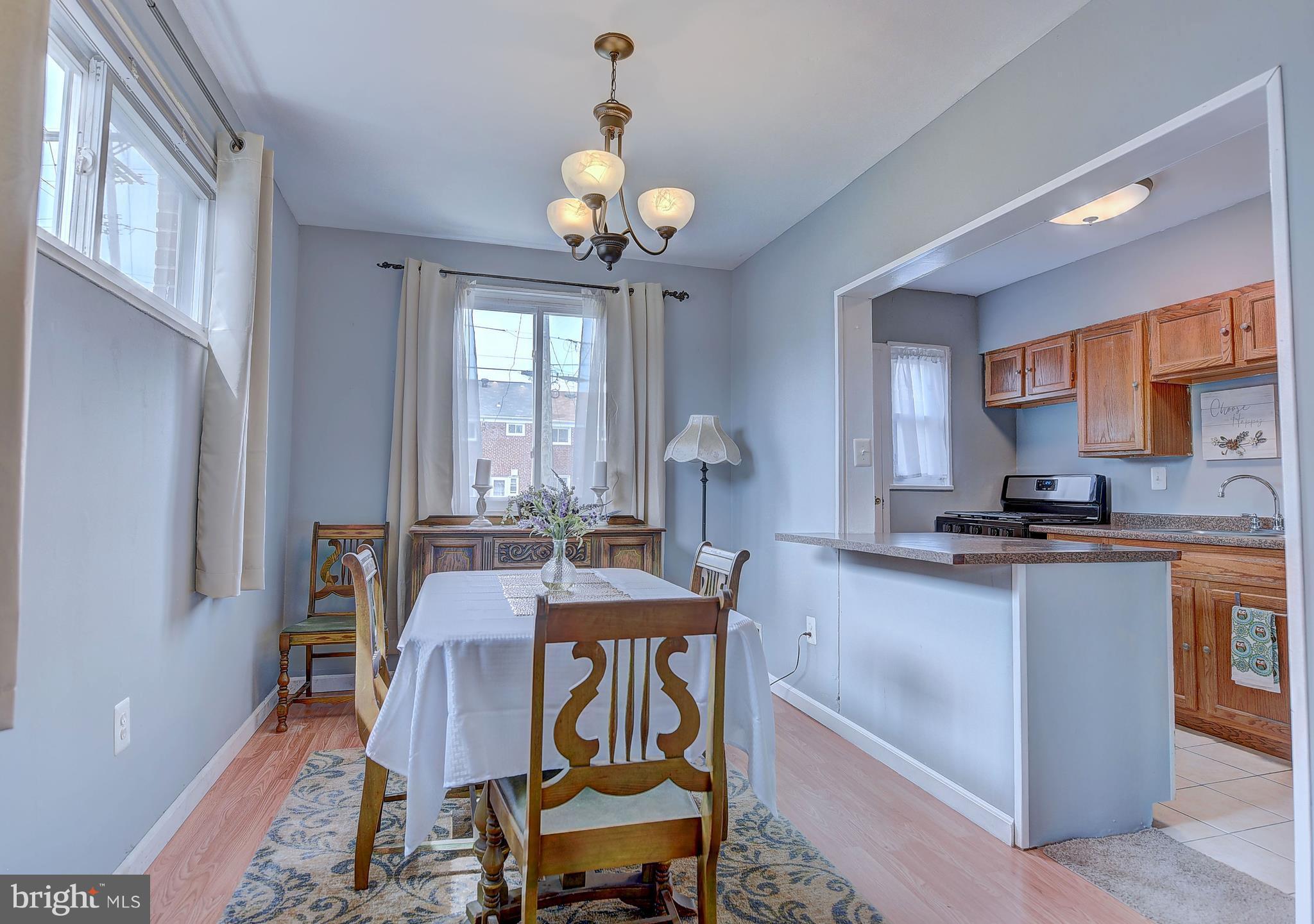 1944 Jasmine Road Baltimore, MD 21222 - Photo 7 of 25 a view of a dining room with furniture window and wooden floor