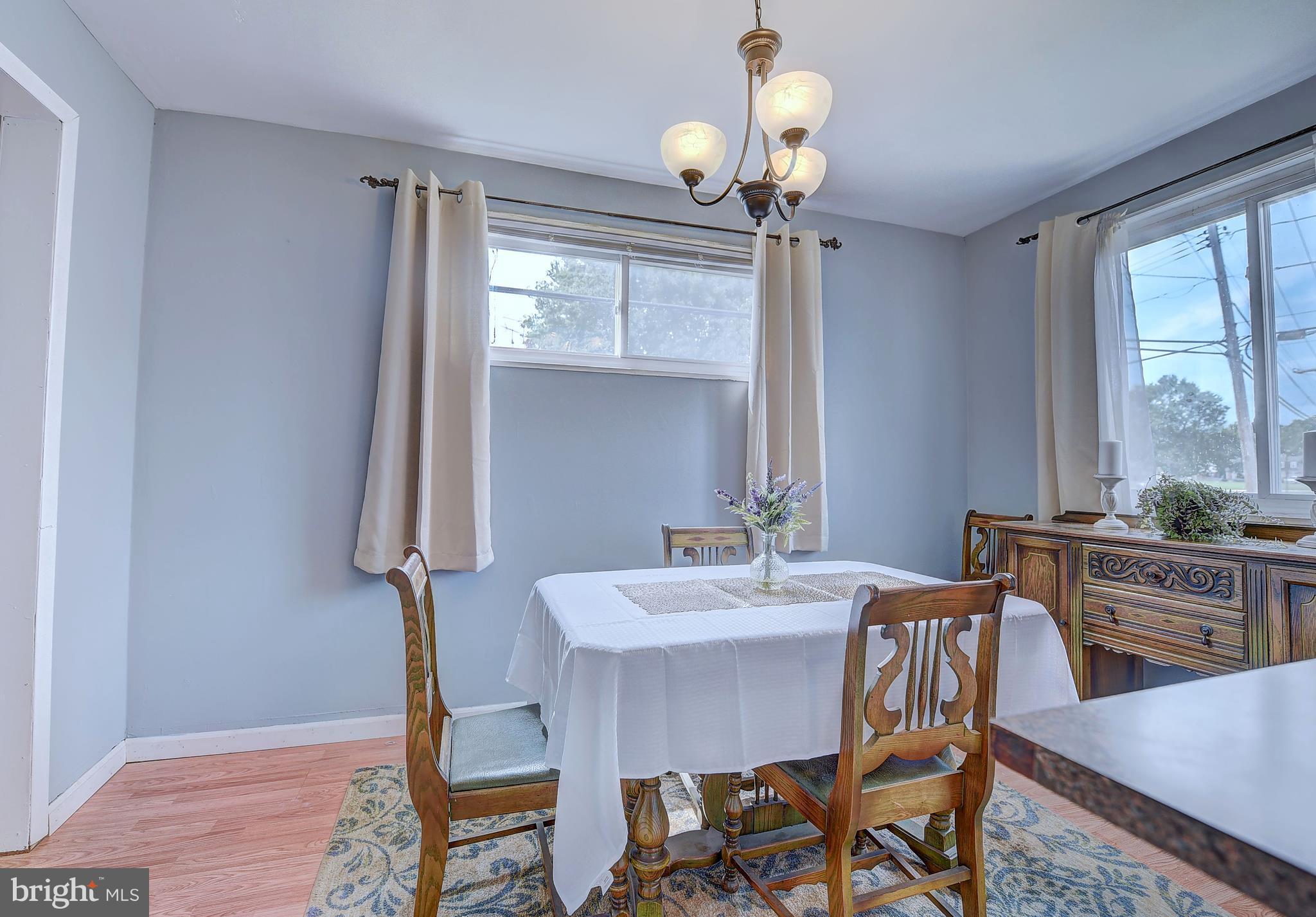 1944 Jasmine Road Baltimore, MD 21222 - Photo 8 of 25 a view of a dining room with furniture wooden floor and chandelier