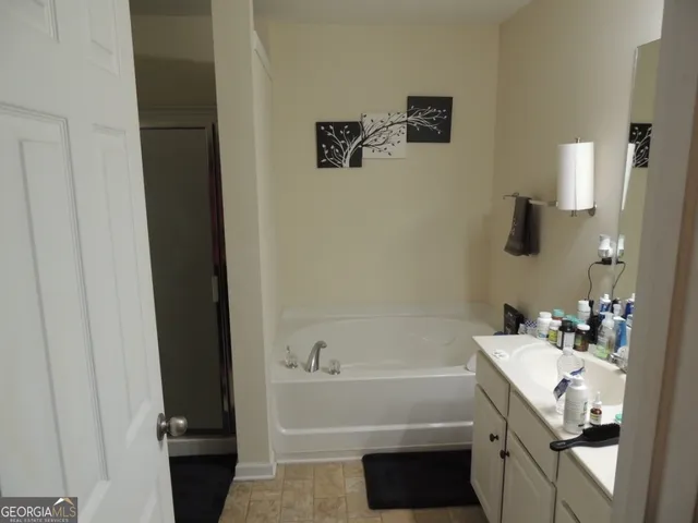 a bathroom with a sink and a bathtub