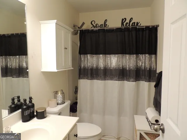 a bathroom with a sink and a toilet