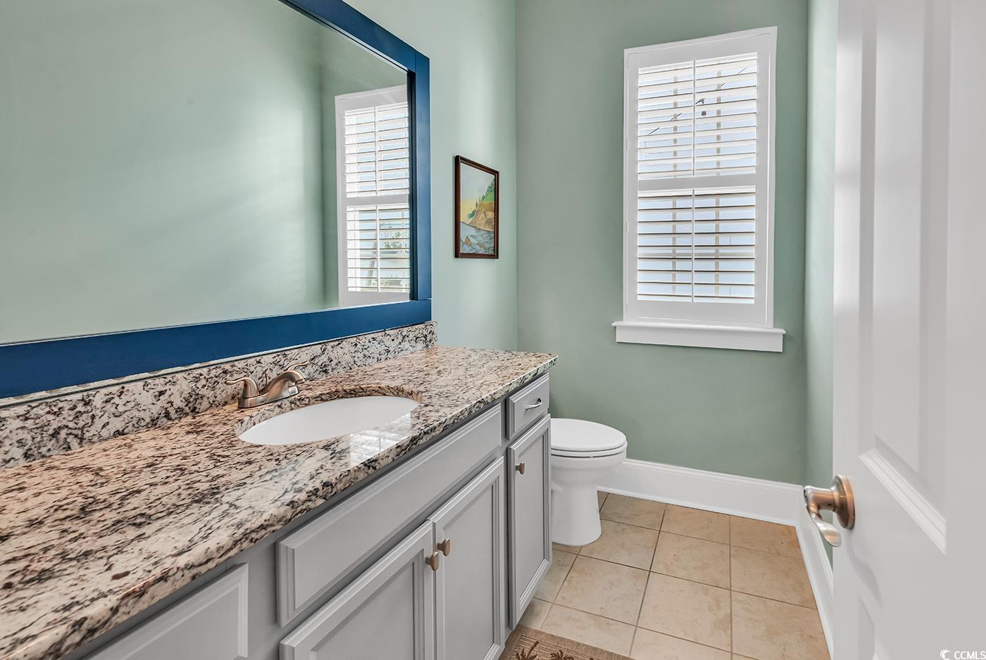 1411 Peterson Street Myrtle Beach, SC 29577 - Photo 13 of 40 Bathroom featuring vanity and light tile patterned flooring