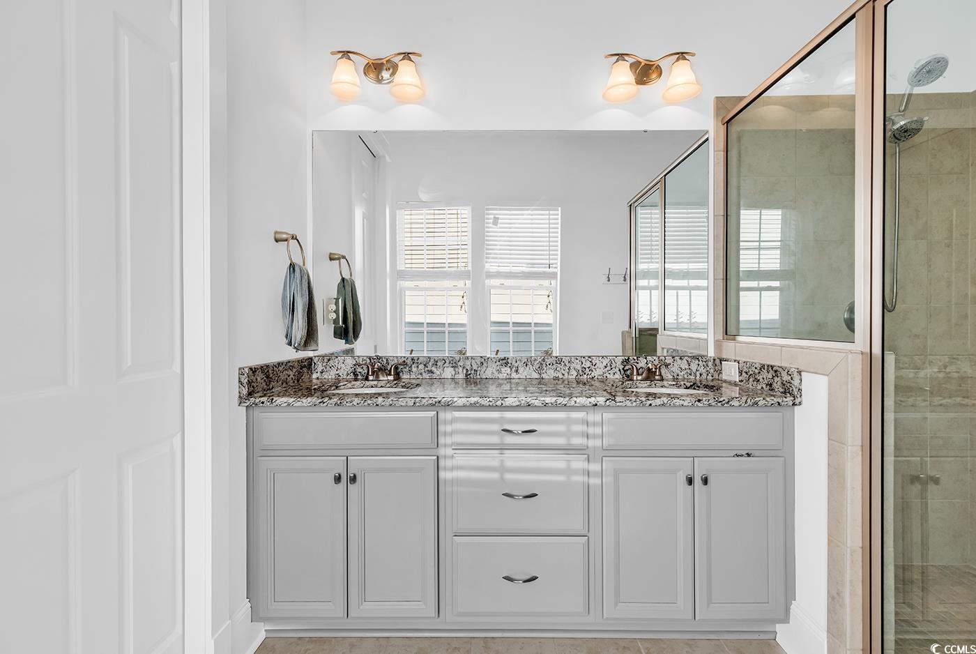 1411 Peterson Street Myrtle Beach, SC 29577 - Photo 17 of 40 Full bath with a shower stall and double vanity