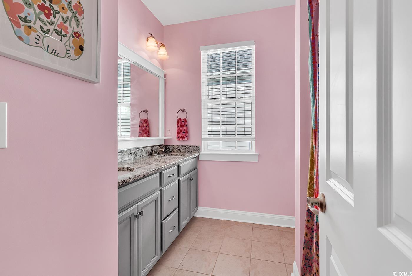 1411 Peterson Street Myrtle Beach, SC 29577 - Photo 24 of 40 Full bath with double vanity and light tile patterned flooring