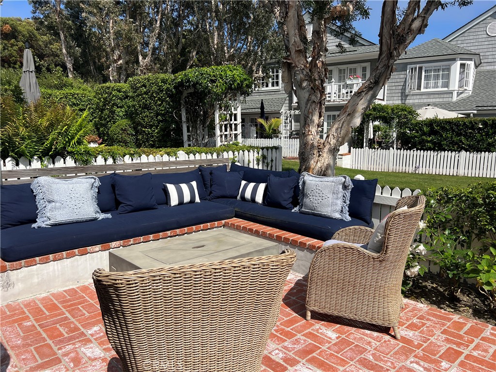 33908 Cape Cove Dana Point, CA 92629 - Photo 15 of 71 a view of a patio with couches table and chairs and potted plants
