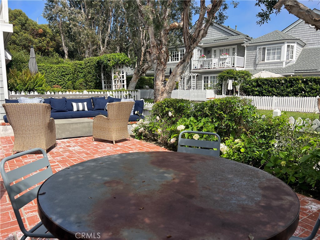33908 Cape Cove Dana Point, CA 92629 - Photo 18 of 71 a view of a patio with table and chairs and potted plants