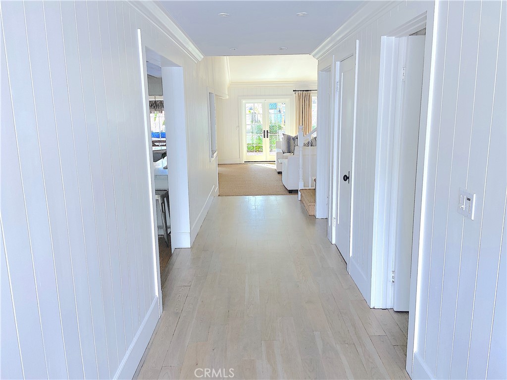 33908 Cape Cove Dana Point, CA 92629 - Photo 21 of 71 a view of a hallway with wooden floor