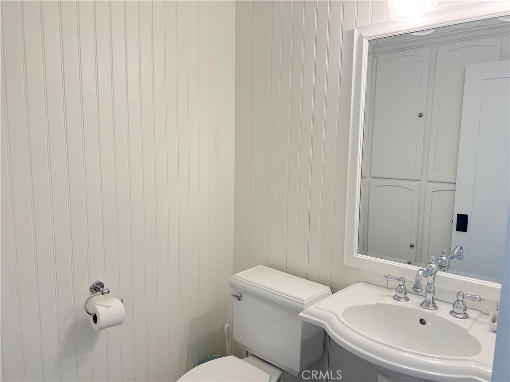 33908 Cape Cove Dana Point, CA 92629 - Photo 22 of 71 a bathroom with a sink mirror and toilet