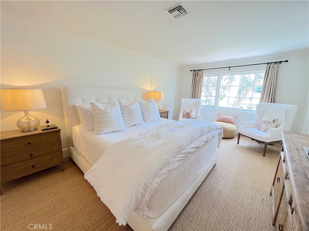 33908 Cape Cove Dana Point, CA 92629 - Photo 37 of 71 a spacious bedroom with a bed and a window