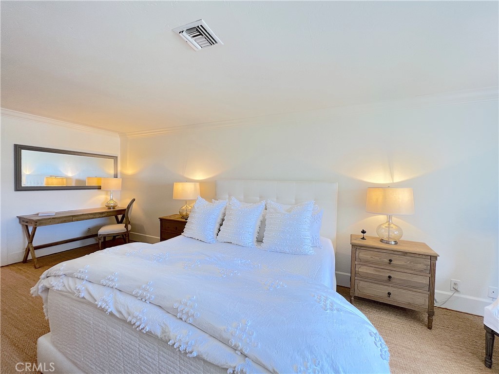 33908 Cape Cove Dana Point, CA 92629 - Photo 40 of 71 a bedroom with a bed and a night stand