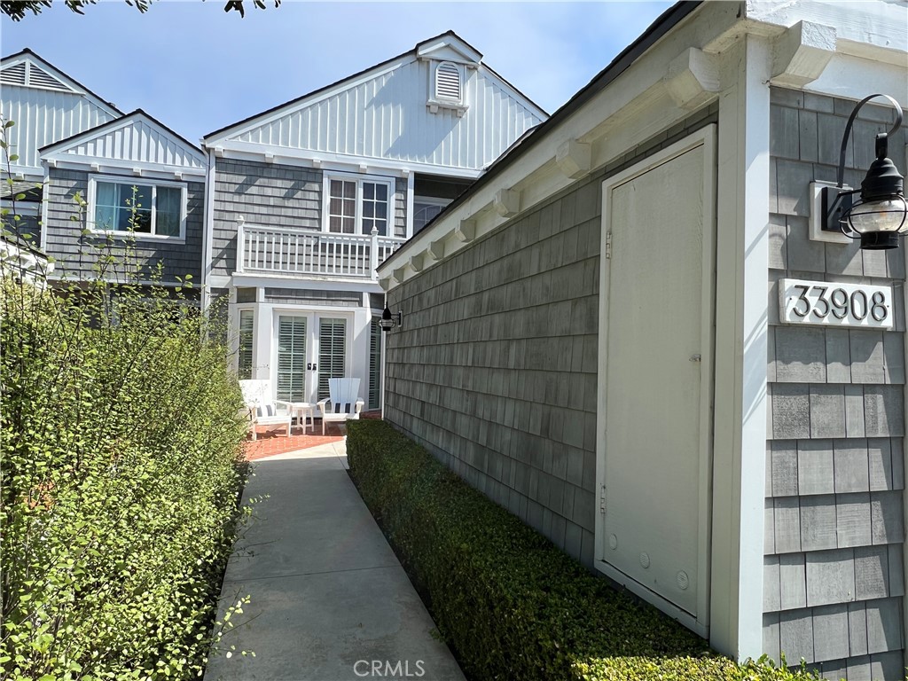 33908 Cape Cove Dana Point, CA 92629 - Photo 4 of 71 a view of a house with a small yard and furniture