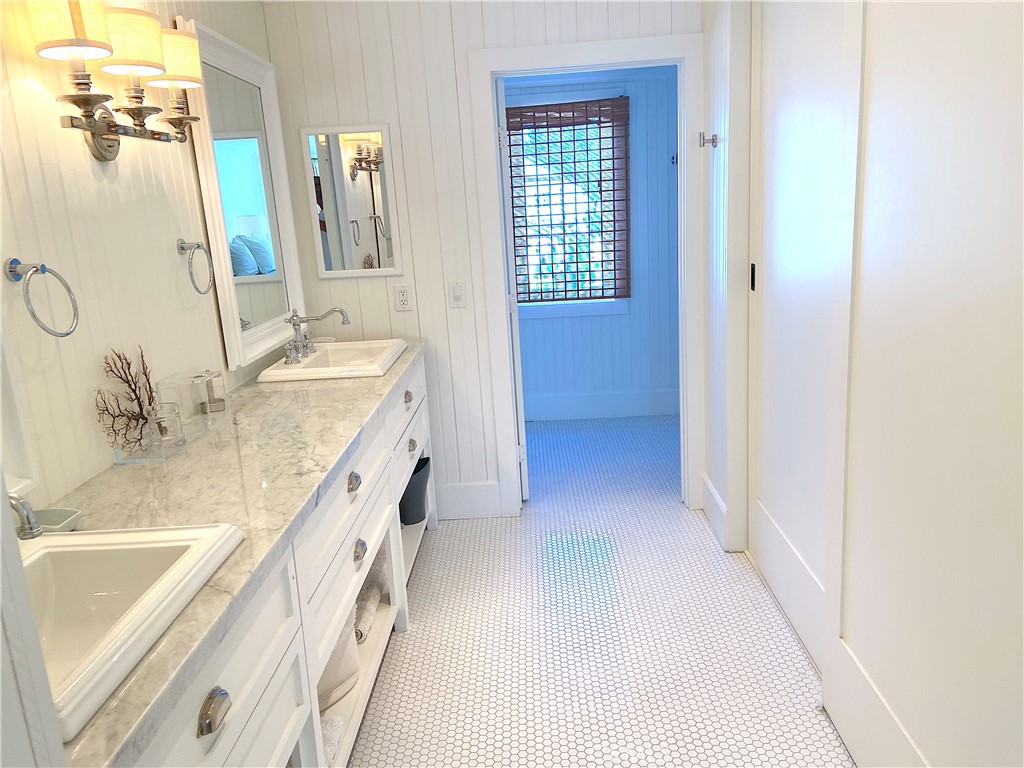 33908 Cape Cove Dana Point, CA 92629 - Photo 45 of 71 a spacious bathroom with a granite countertop sink a mirror and a bathtub