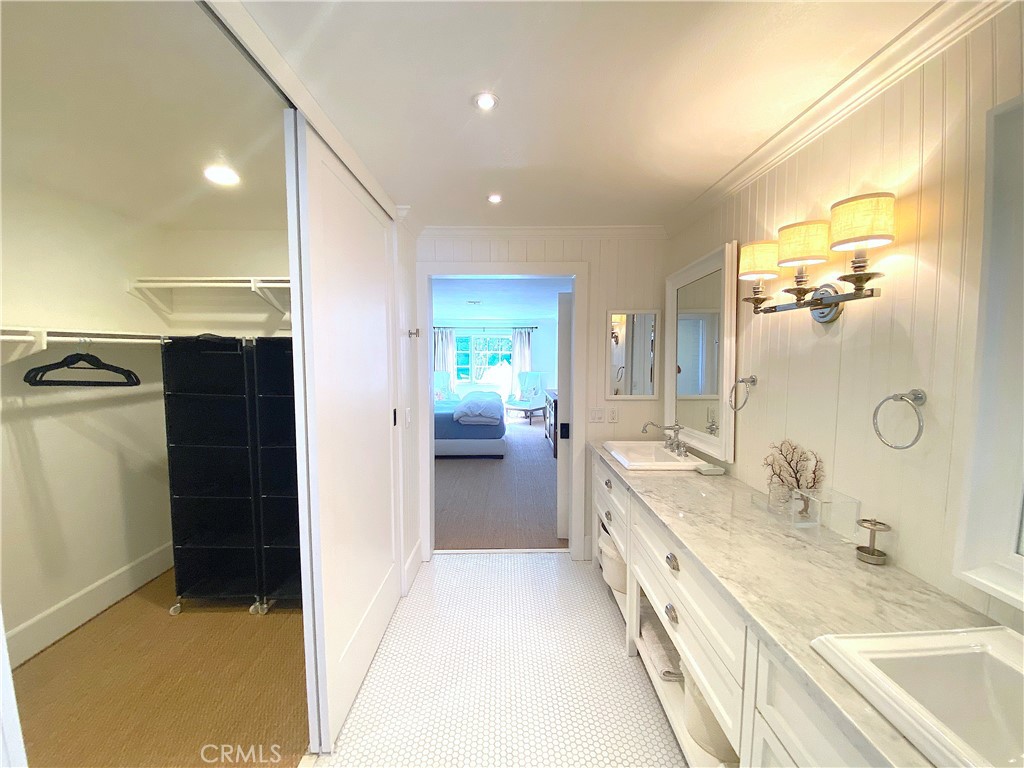 33908 Cape Cove Dana Point, CA 92629 - Photo 47 of 71 a spacious bathroom with a tub sink and mirror