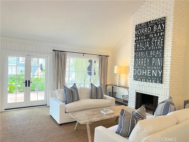 a living room with furniture fireplace and a fireplace