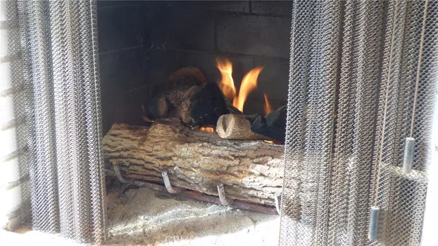 a view of a patio with couches table and chairs and potted plants