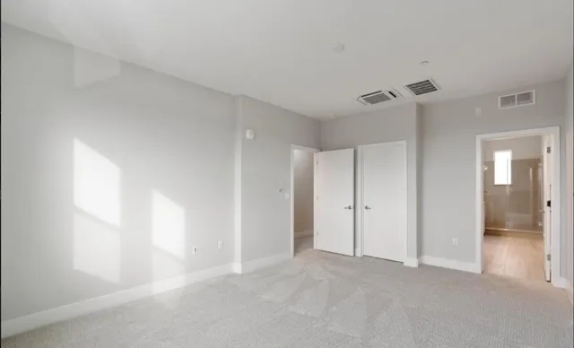 a bathroom with a sink double vanity and a mirror